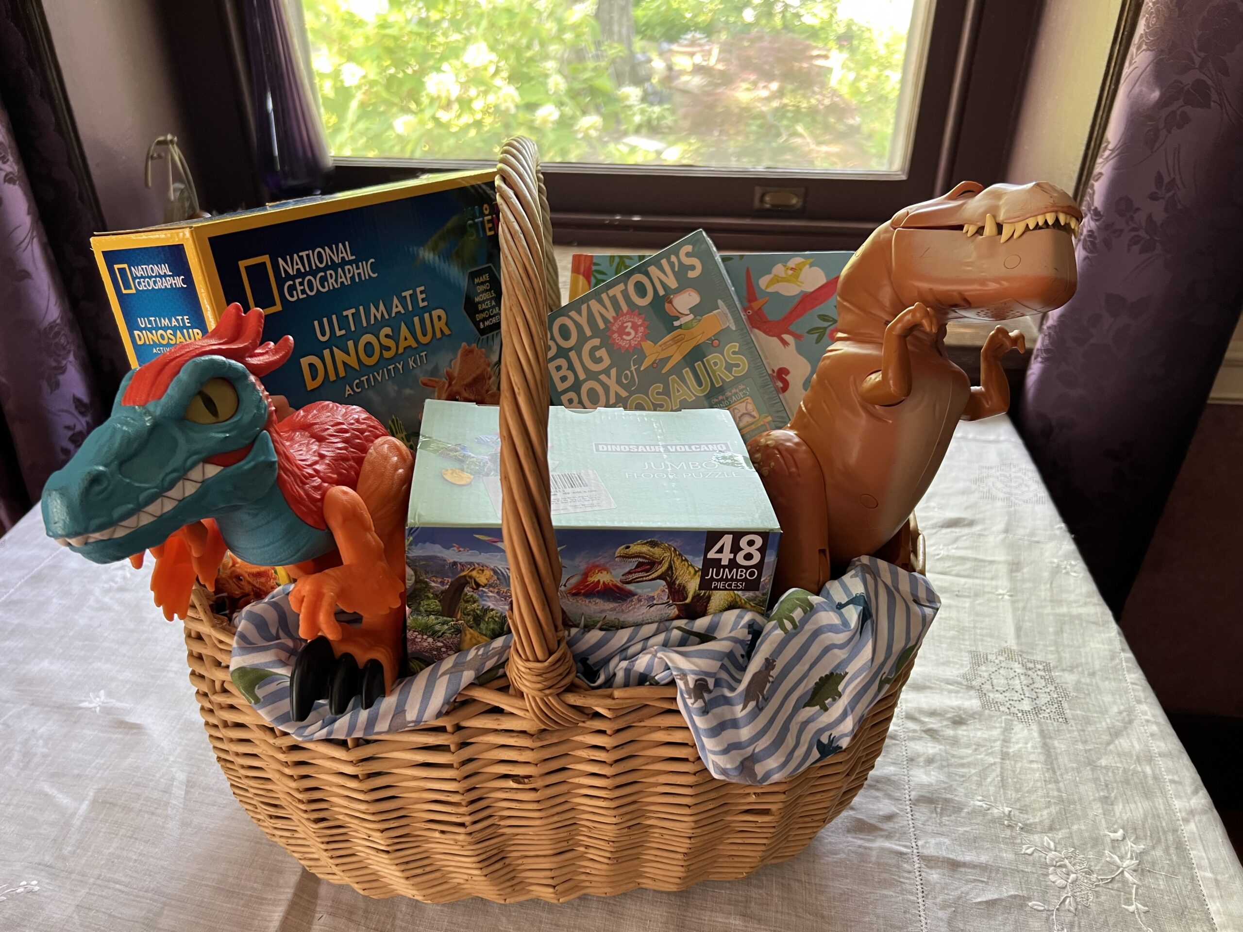 The Dino-mite Dinosaur Raffle Basket, with all of it's contents displayed